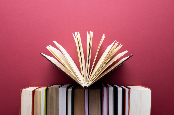 books-and-notebooks-in-row-with-opened-notebook